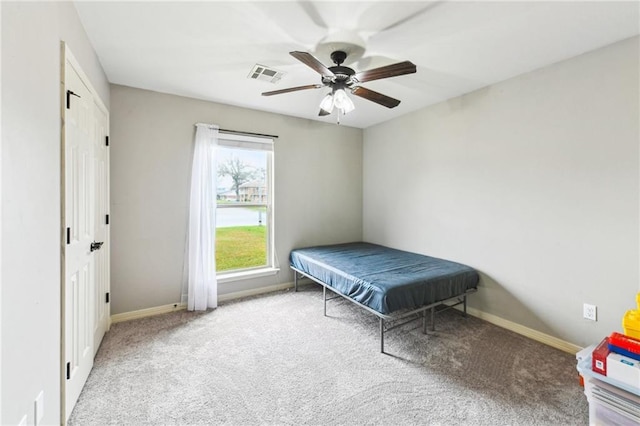 bedroom featuring carpet, visible vents, ceiling fan, and baseboards