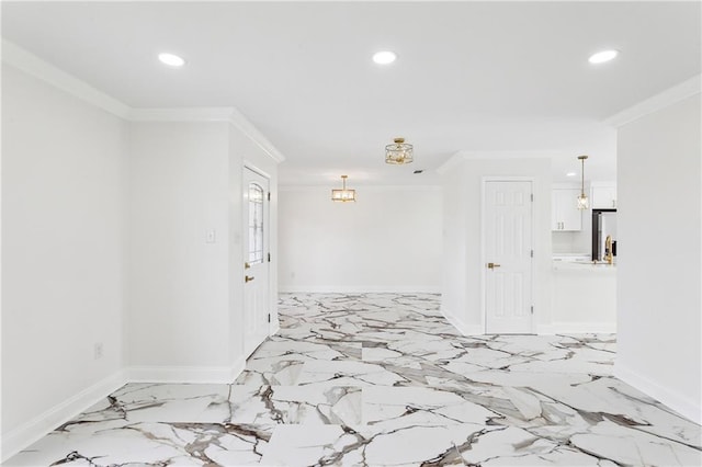 spare room with ornamental molding, recessed lighting, marble finish floor, and baseboards