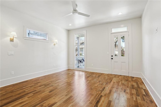 foyer featuring a ceiling fan, recessed lighting, baseboards, and wood finished floors