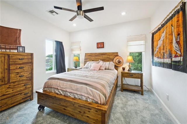 carpeted bedroom featuring baseboards, visible vents, ceiling fan, and recessed lighting