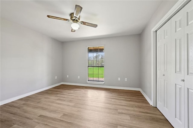 16685 Meissner Rd, Springfield, LA 70462 - unfurnished bedroom with a ceiling fan, baseboards, a closet, and light wood finished floors