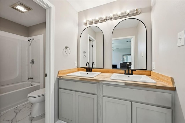 16685 Meissner Rd, Springfield, LA 70462 - bathroom featuring marble finish floor, a sink, toilet, and visible vents