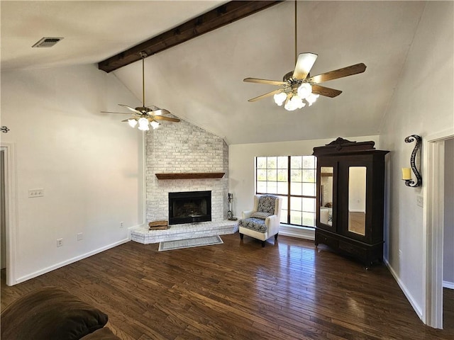 unfurnished living room featuring lofted ceiling with beams, ceiling fan, baseboards, and wood finished floors