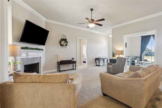 carpeted living room with ornamental molding, a premium fireplace, and baseboards