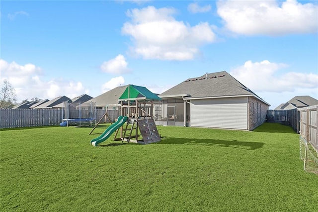 view of play area with a yard and a fenced backyard