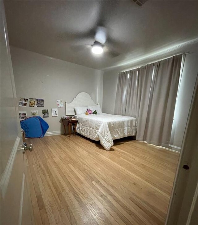 312 W Robert E Lee Blvd, New Orleans, LA 70124 - bedroom with ceiling fan, baseboards, and wood finished floors