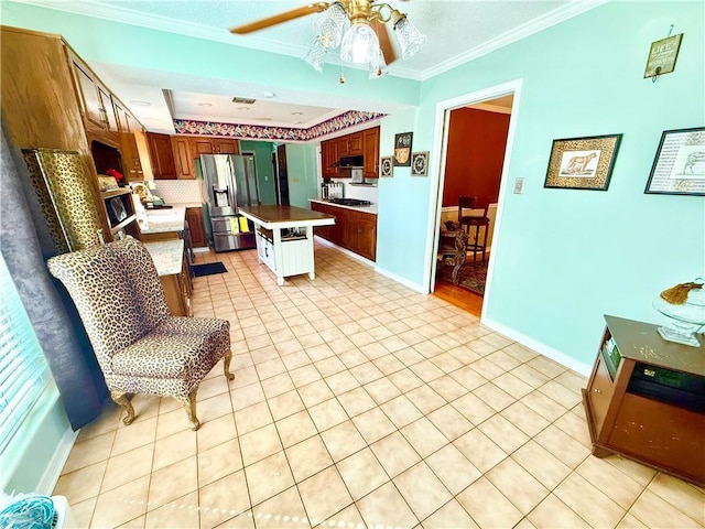 5 Five Oaks Dr, New Orleans, LA 70131 - kitchen featuring stainless steel refrigerator with ice dispenser, ceiling fan, crown molding, light tile patterned flooring, and a kitchen island