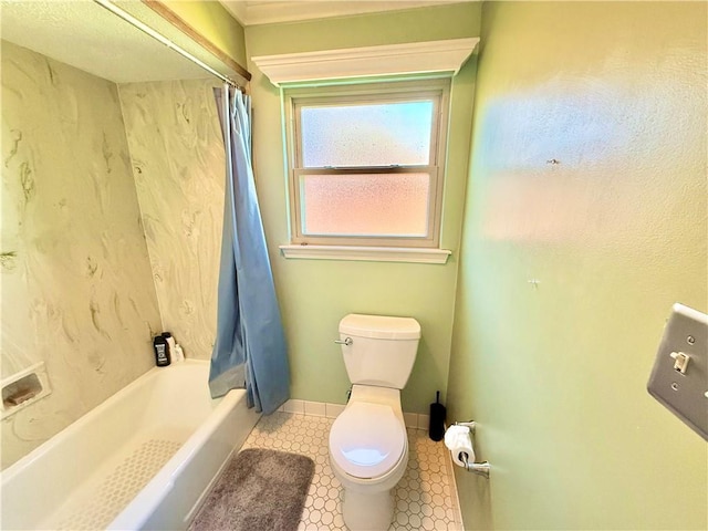 full bathroom with baseboards, toilet, shower / bath combo with shower curtain, and tile patterned flooring