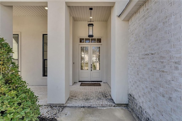 doorway to property with french doors and stucco siding