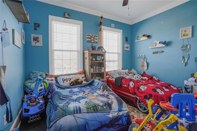 bedroom featuring a ceiling fan and crown molding