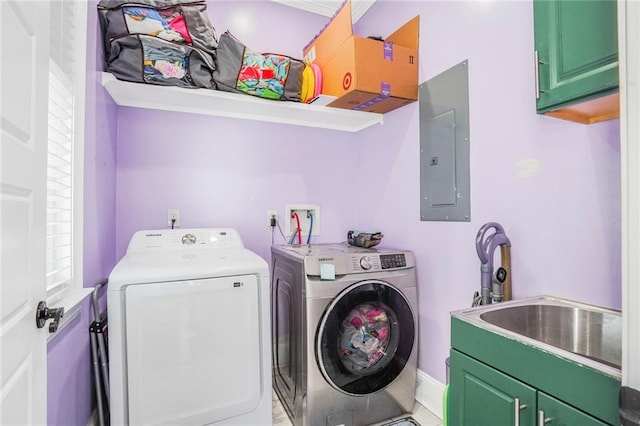 washroom featuring cabinet space, electric panel, baseboards, washer and dryer, and a sink