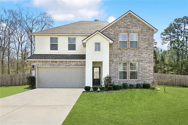 traditional-style home with driveway, brick siding, a front yard, and fence