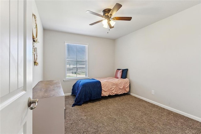 carpeted bedroom featuring ceiling fan and baseboards