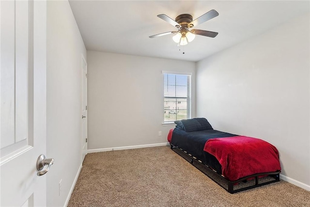 bedroom featuring a ceiling fan, carpet flooring, and baseboards