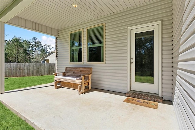 view of patio featuring fence