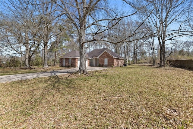 view of yard with concrete driveway