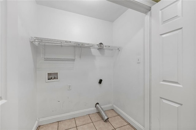 laundry room featuring light tile patterned floors, laundry area, hookup for a washing machine, and baseboards