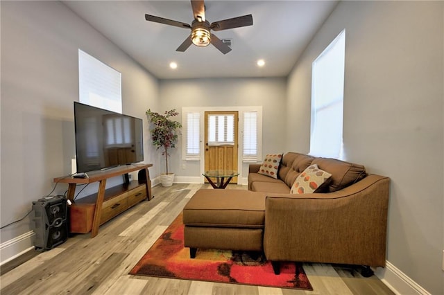 living room with recessed lighting, baseboards, ceiling fan, and light wood finished floors