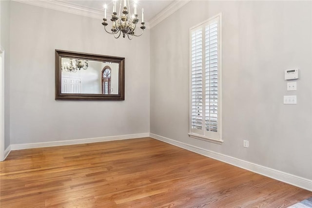 unfurnished dining area with crown molding, light wood-style floors, and baseboards