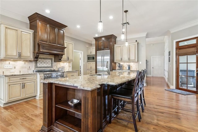 kitchen with light stone counters, open shelves, ornamental molding, built in appliances, and light wood-type flooring