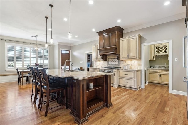 kitchen with tasteful backsplash, light stone counters, light wood-style floors, stainless steel stove, and open shelves