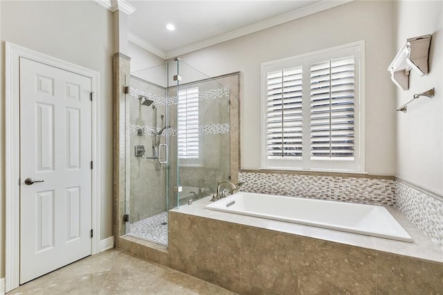 full bathroom featuring a shower stall, a bath, and ornamental molding