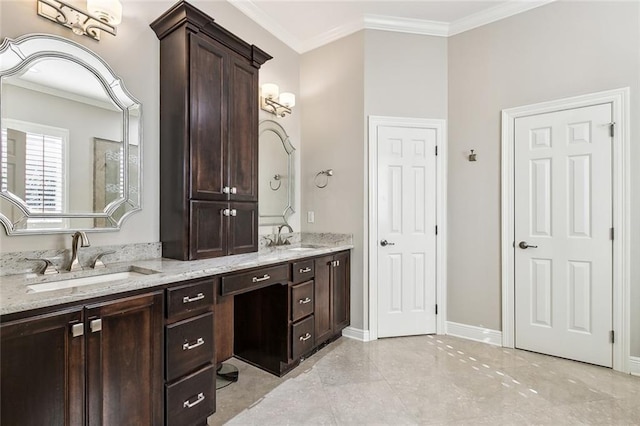 full bath with a sink, baseboards, double vanity, and crown molding