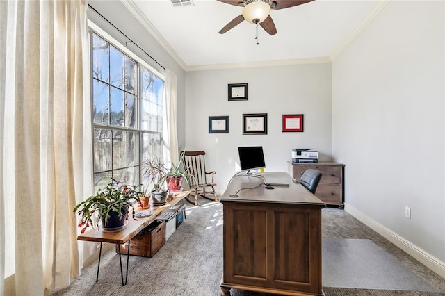 office space featuring visible vents, crown molding, carpet, baseboards, and a ceiling fan