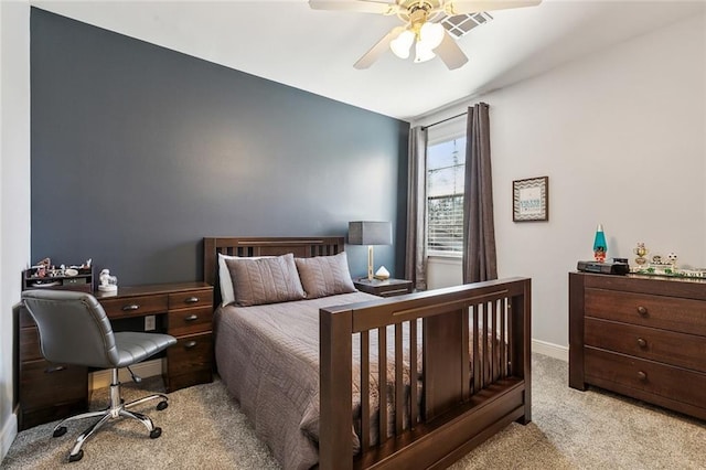 carpeted bedroom featuring ceiling fan and baseboards