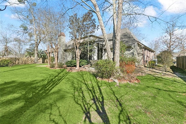 view of yard featuring fence