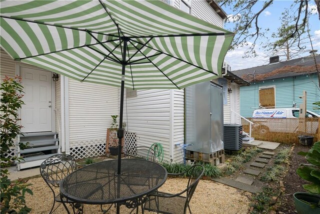 view of patio with entry steps and central AC