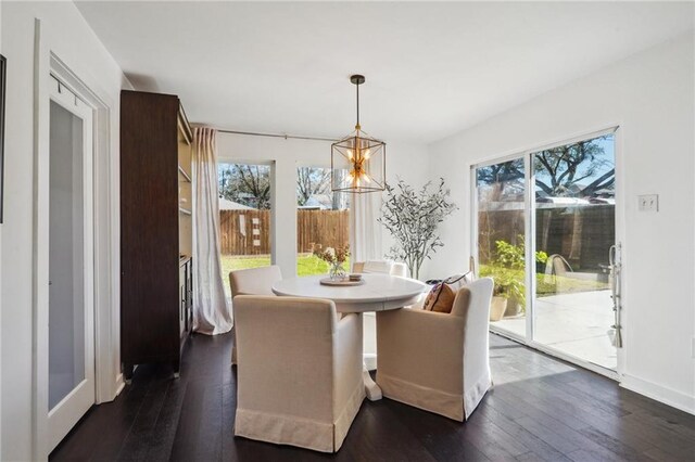 dining space featuring dark wood-style floors and a wealth of natural light