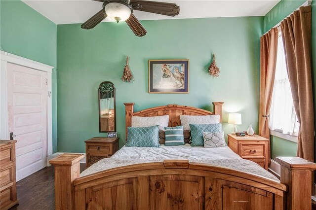 bedroom with dark wood-type flooring and ceiling fan