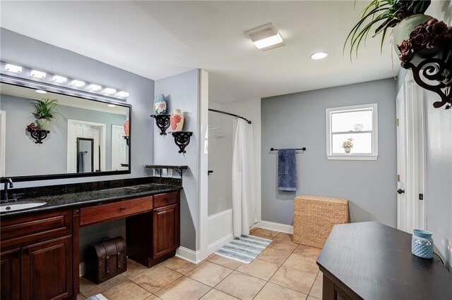 full bathroom featuring baseboards, shower / bathtub combination with curtain, vanity, and tile patterned floors