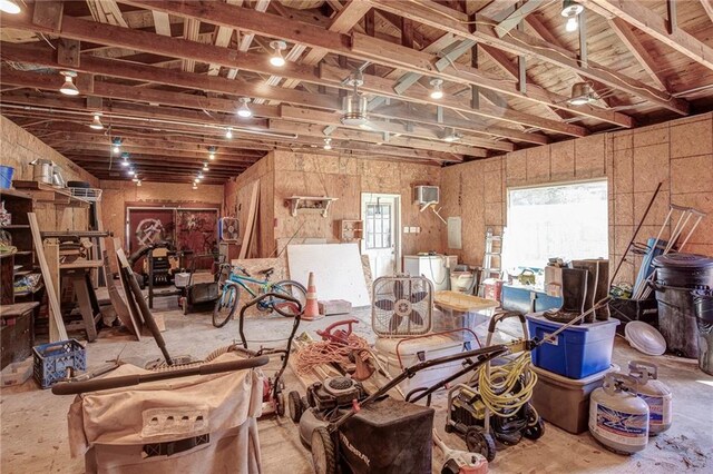 miscellaneous room with washer / clothes dryer and a wall mounted AC