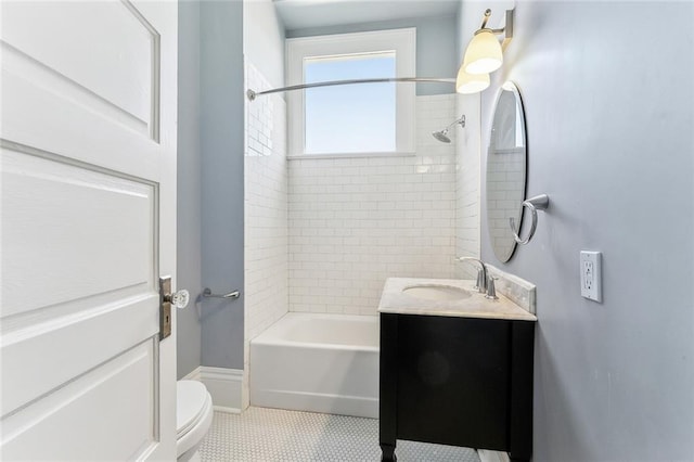 full bathroom with  shower combination, vanity, toilet, and tile patterned floors