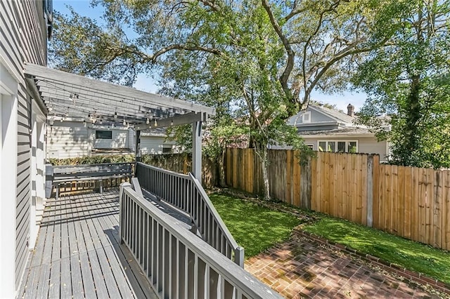 deck featuring fence and a pergola