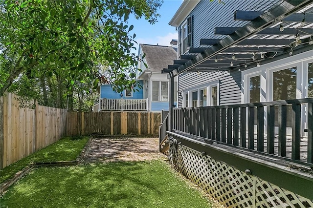 view of yard featuring a fenced backyard and a pergola