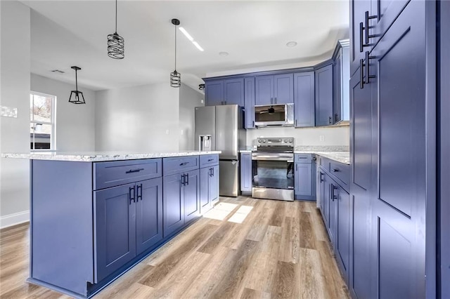 7909 Tarpon St, New Orleans, LA 70126 - kitchen featuring stainless steel appliances, blue cabinetry, light wood finished floors, and decorative light fixtures