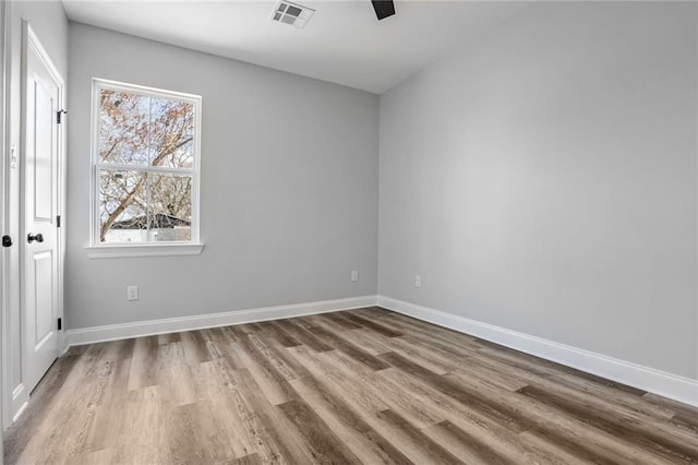 7909 Tarpon St, New Orleans, LA 70126 - unfurnished bedroom featuring wood finished floors, baseboards, and ceiling fan
