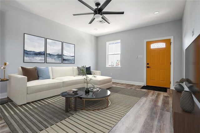 7909 Tarpon St, New Orleans, LA 70126 - living area with wood finished floors, baseboards, and ceiling fan