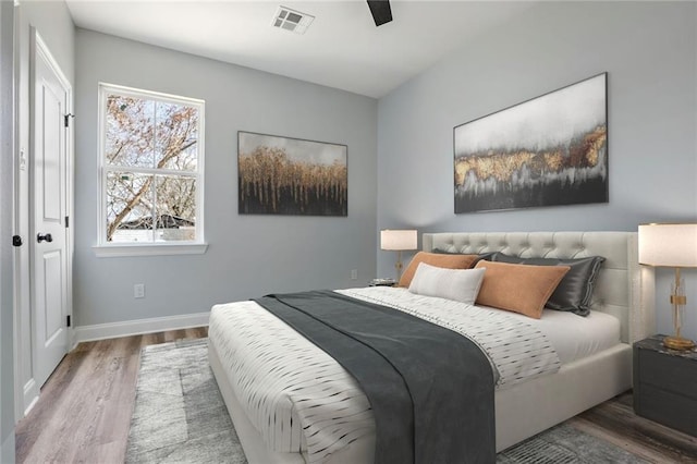 7909 Tarpon St, New Orleans, LA 70126 - bedroom featuring wood finished floors, baseboards, and ceiling fan