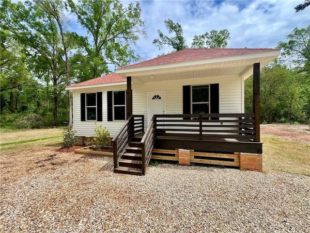 view of front of house featuring a porch and a shingled roof