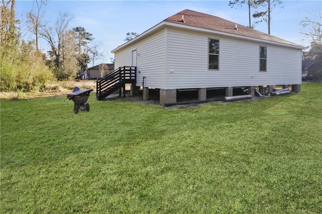 back of house with a lawn