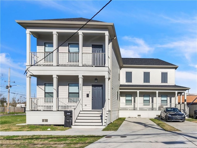 view of front of home featuring covered porch and a balcony