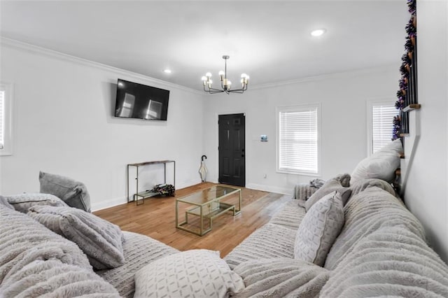 living area featuring crown molding and wood finished floors