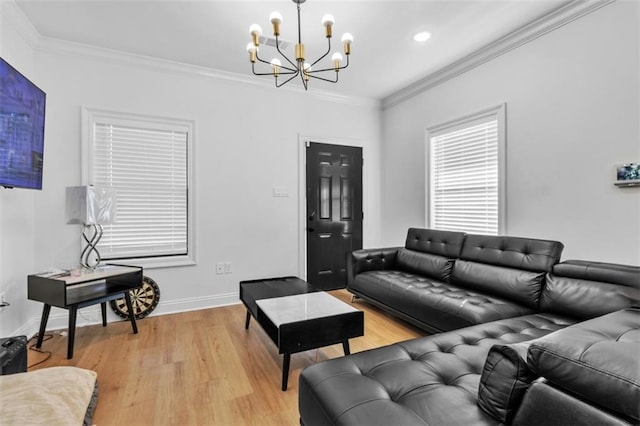 living room featuring light wood-type flooring, baseboards, and ornamental molding