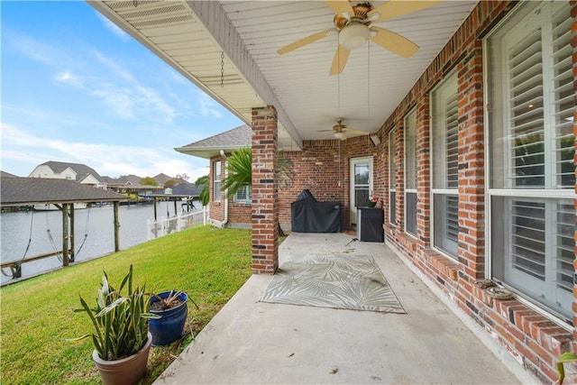 view of patio / terrace featuring ceiling fan, area for grilling, and fence