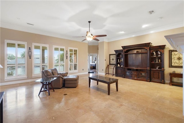 living area with baseboards, visible vents, and crown molding