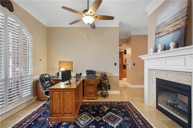 home office featuring a fireplace with flush hearth, crown molding, baseboards, and a ceiling fan